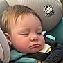 accessories, baby, belt, blanket, car, car_interior, carseat, cushion, electronics, face, frown, head, headrest, homedecor, person, photography, portrait, sleeping, transportation, vehicle