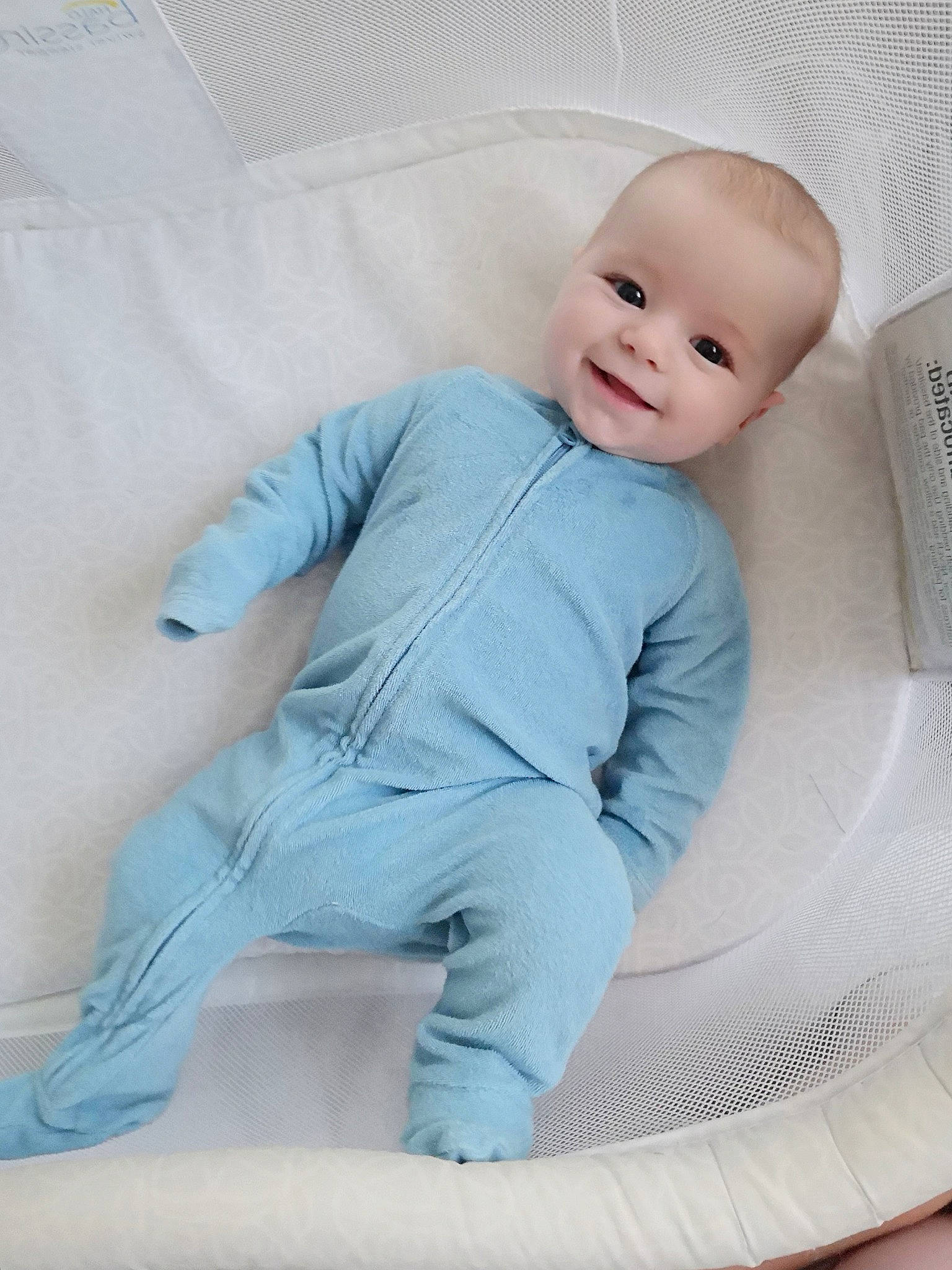 Jude is registered to the contest to win money with this photo: baby, baby_products, baby_toddler_clothing, bedding, blue, child, comfort, infant_bed, joy, person, product, sitting, skin, toddler