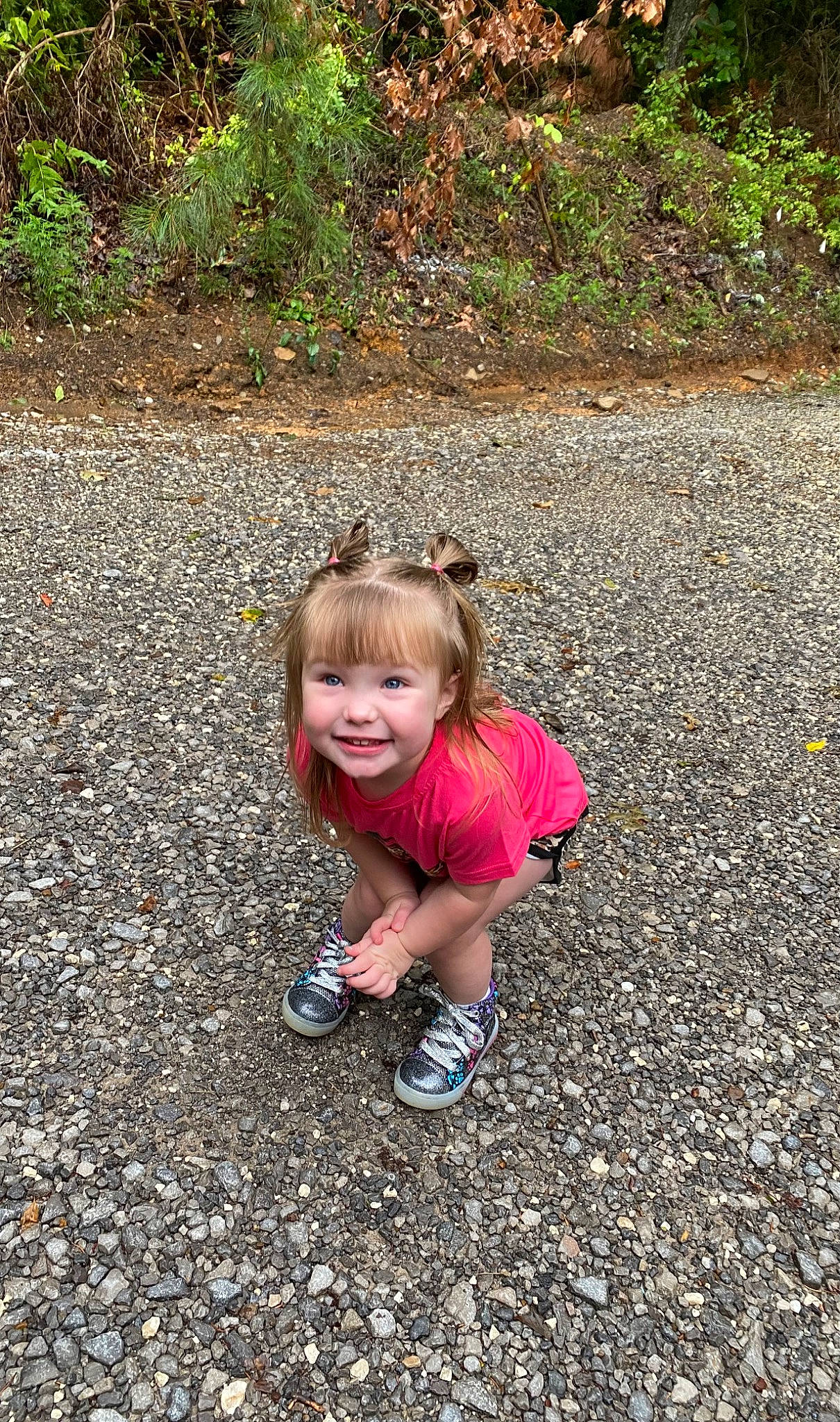 Rylee is registered to the contest to win money with this photo: asphalt, baby_toddler_clothing, fun, grass, happy, joy, landscape, leisure, mammal, natural_environment, people_in_nature, person, plant, road_surface, sand, sitting, smile, soil, toddler, tree