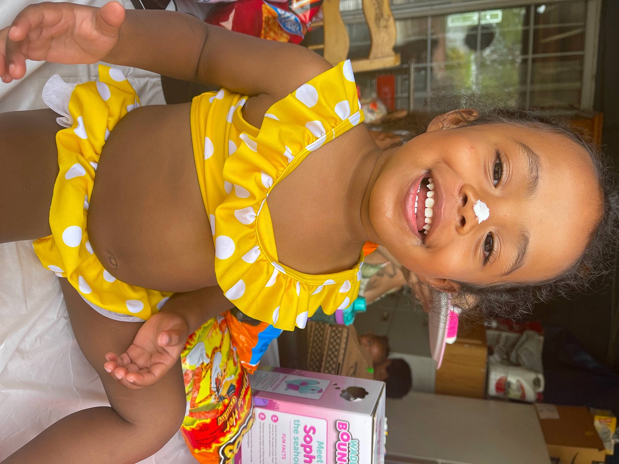 Jaide joined the competition — help win amazing prizes! arm, box, child, event, finger, fun, hairstyle, hand, happy, human_leg, joy, leisure, mouth, party, person, room, shipping_box, smile, thigh, toddler