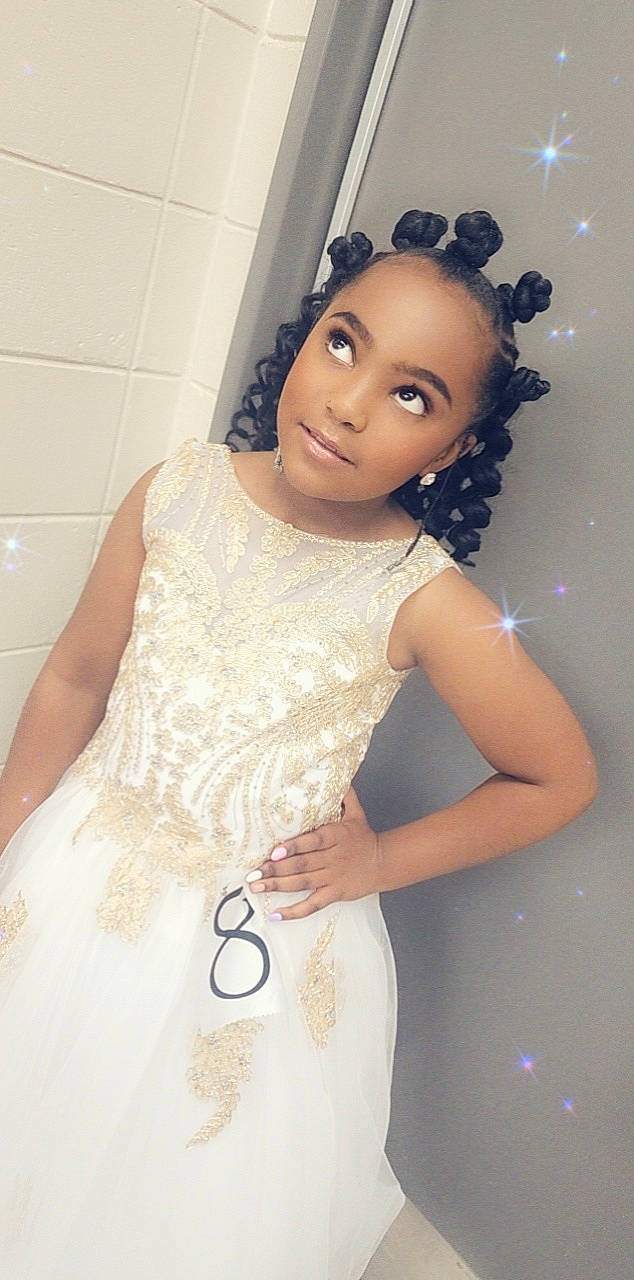 Kaylynn is registered to the contest to win money with this photo: bridal_clothing, bridal_party_dress, dress, embellishment, eye, eyebrow, eyelash, flash_photography, hair, hairstyle, hand, happy, head, neck, one_piece_garment, person, shoulder, skin, sleeve, waist