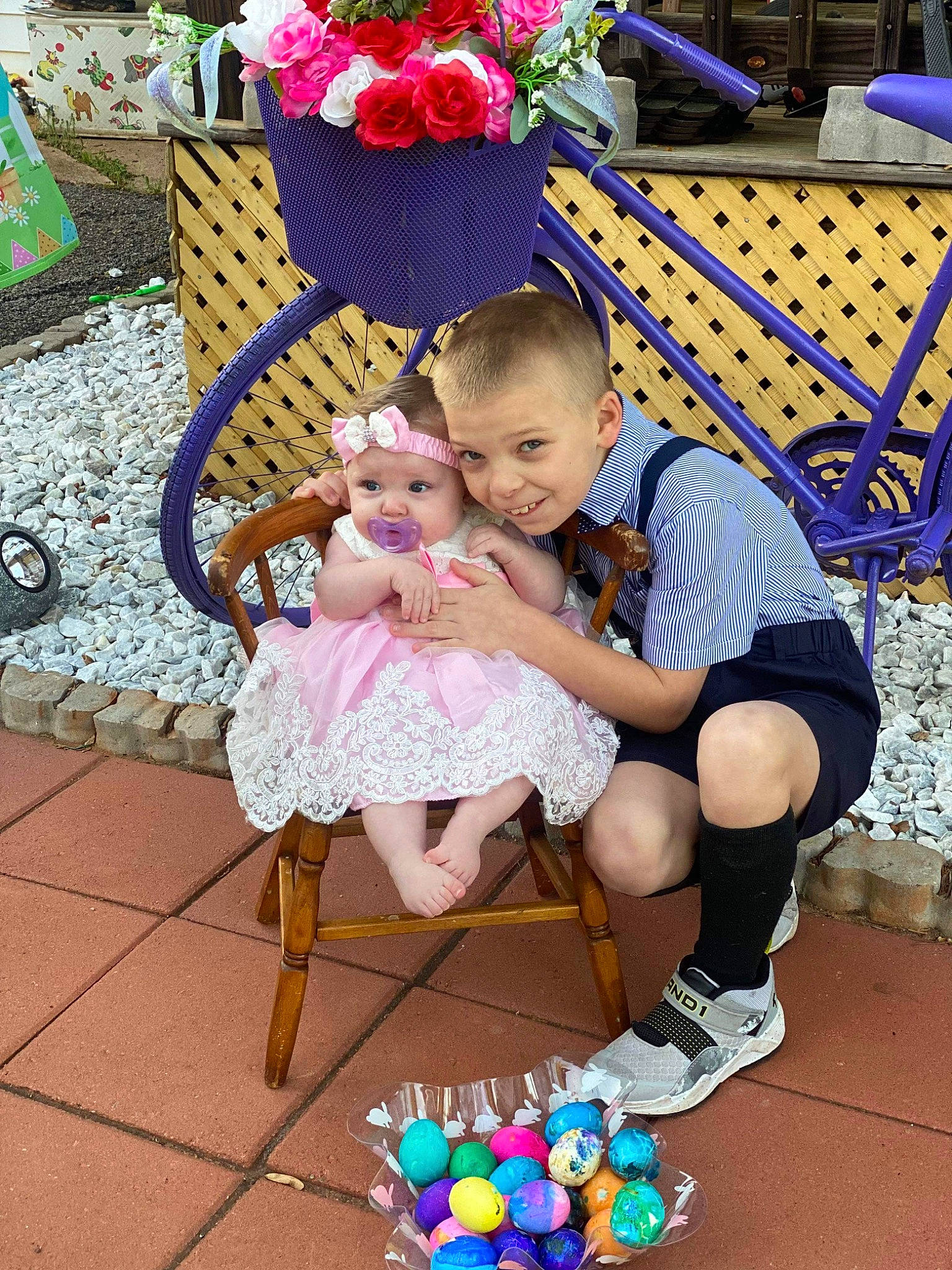 Bently is registered to the contest to win money with this photo: baby, baby_toddler_clothing, blue, chair, child, event, flower, fun, happy, headwear, lap, leg, leisure, party, person, pink, plant, purple, shorts, sitting