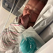 Rayliana joined the competition — help win amazing prizes! baby, bassinet, bed, blanket, child, cute, healthcare, hospital, indoors, infant, maternity, newborn, nursery, pacifier, peaceful, person, resting, sleeping, swaddled, wrapped