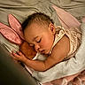 Kimora is registered to the contest to win money with this photo: baby, bed, blanket, child, comfort, cozy, cuddling, cute, ears, home, infant, nap, peaceful, pink, plush_toy, rest, sleep, sleeping, soft, toddler