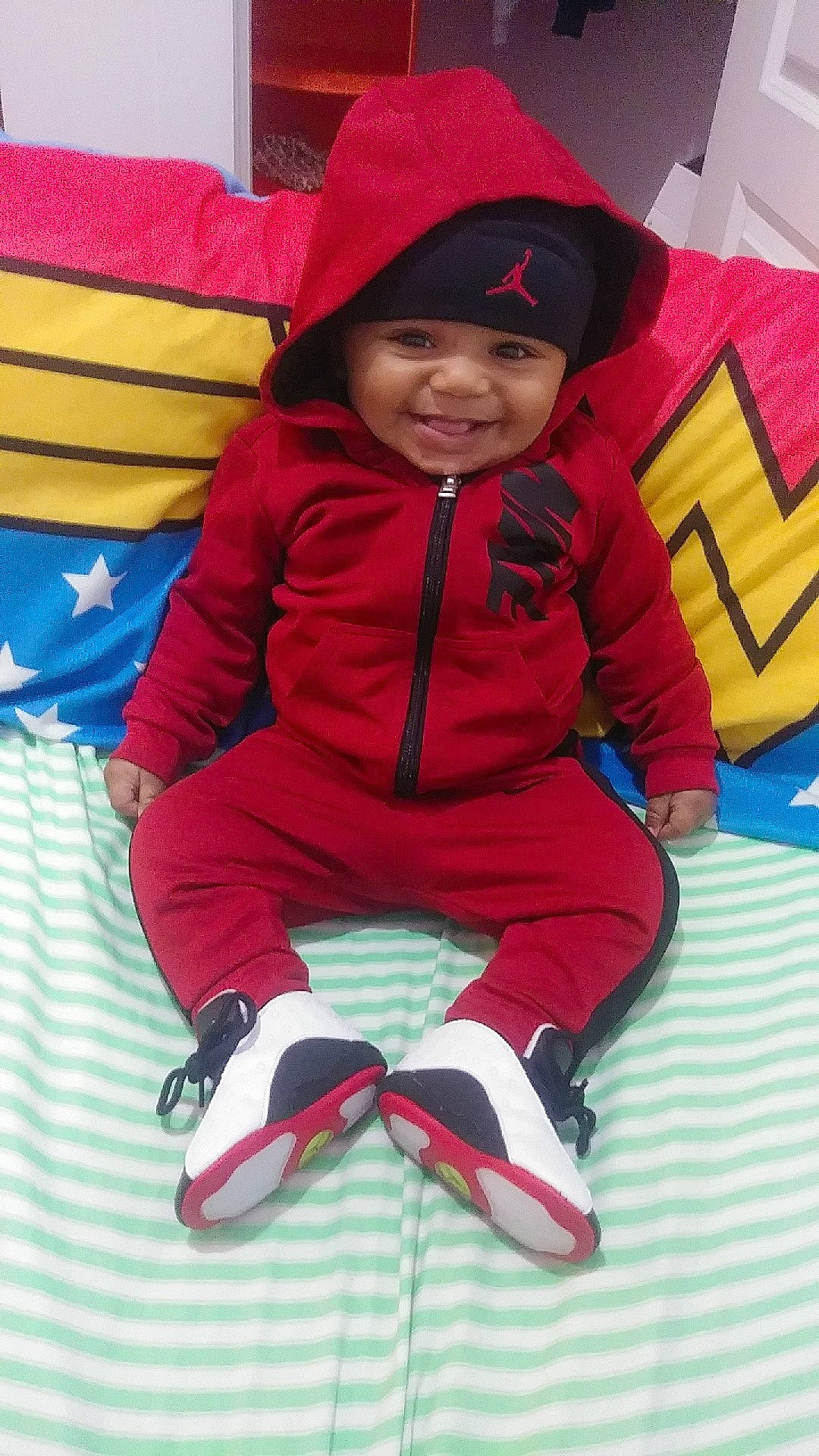 Maison is registered to the contest to win money with this photo: child, day, fun, girl, headgear, infant, joy, outerwear, person, pink, play, product, red, skin, smile, textile, toddler