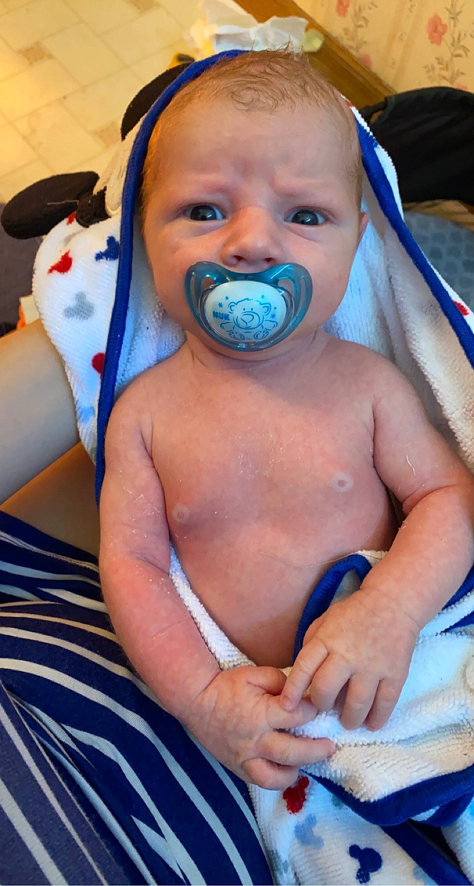 Garrett is registered to the contest to win money with this photo: abdomen, baby, beard, blue, cheek, chest, child, event, facial_expression, finger, hairstyle, hand, happy, human, human_body, mouth, nose, people, person, skin
