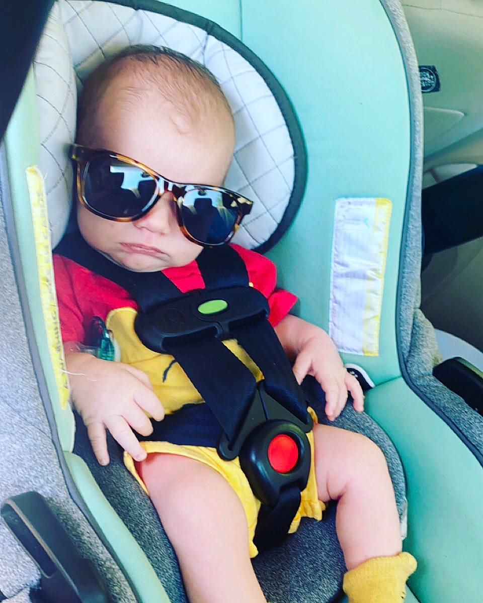 Garrett is registered to the contest to win money with this photo: auto_part, automotive_design, baby, baby_products, baby_toddler_clothing, car_seat, carmine, child, comfort, electric_blue, eyewear, fun, goggles, leisure, person, personal_protective_equipment, sunglasses, thigh, thumb, toddler