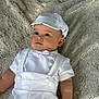 Chayce is registered to the contest to win money with this photo: baby, infant, white_clothing, cap, blanket, lying_down, cute, child, soft_texture, indoor, portrait, face, skin, hands, short_sleeves, comfortable, infant_boy, baby_outfit, relaxed, adorable