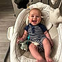 Chayce joined the competition — help win amazing prizes! baby, infant, smiling, swing, toy, star_toy, striped_clothing, romper, indoor, floor, cushion, happy, child, seat, playtime, cute, person, comfort, baby_toy, joyful