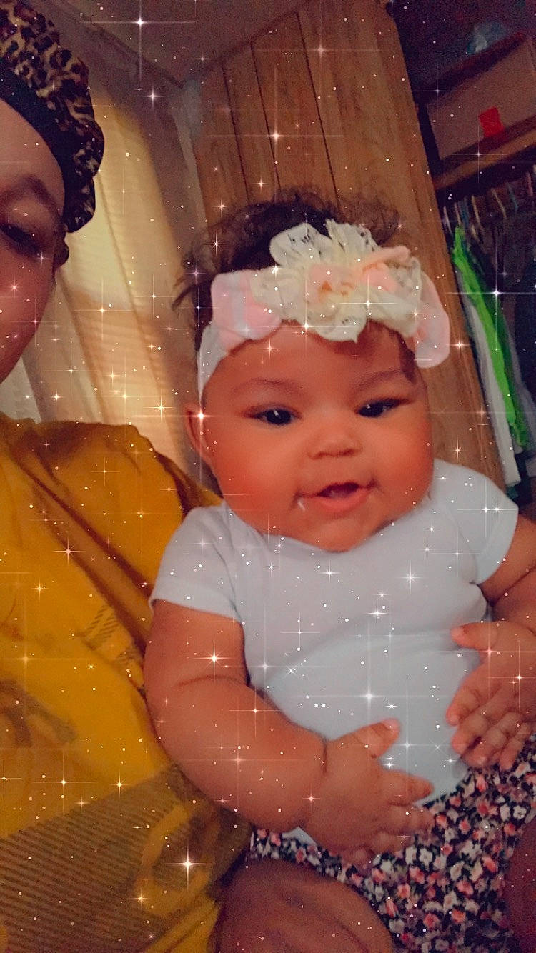 Tori'Yannah is registered to the contest to win money with this photo: baby, cheek, child, eye, face, fun, hair_accessory, head, headpiece, headwear, iris, lip, person, pink, skin, smile, toddler