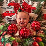 baby, child, smiling, red_bow, christmas_ornaments, holiday, festive, blanket, christmas_trees, red_trucks, decorations, indoors, cute, happy, portrait, celebration, festivity, holiday_season, infant, joy