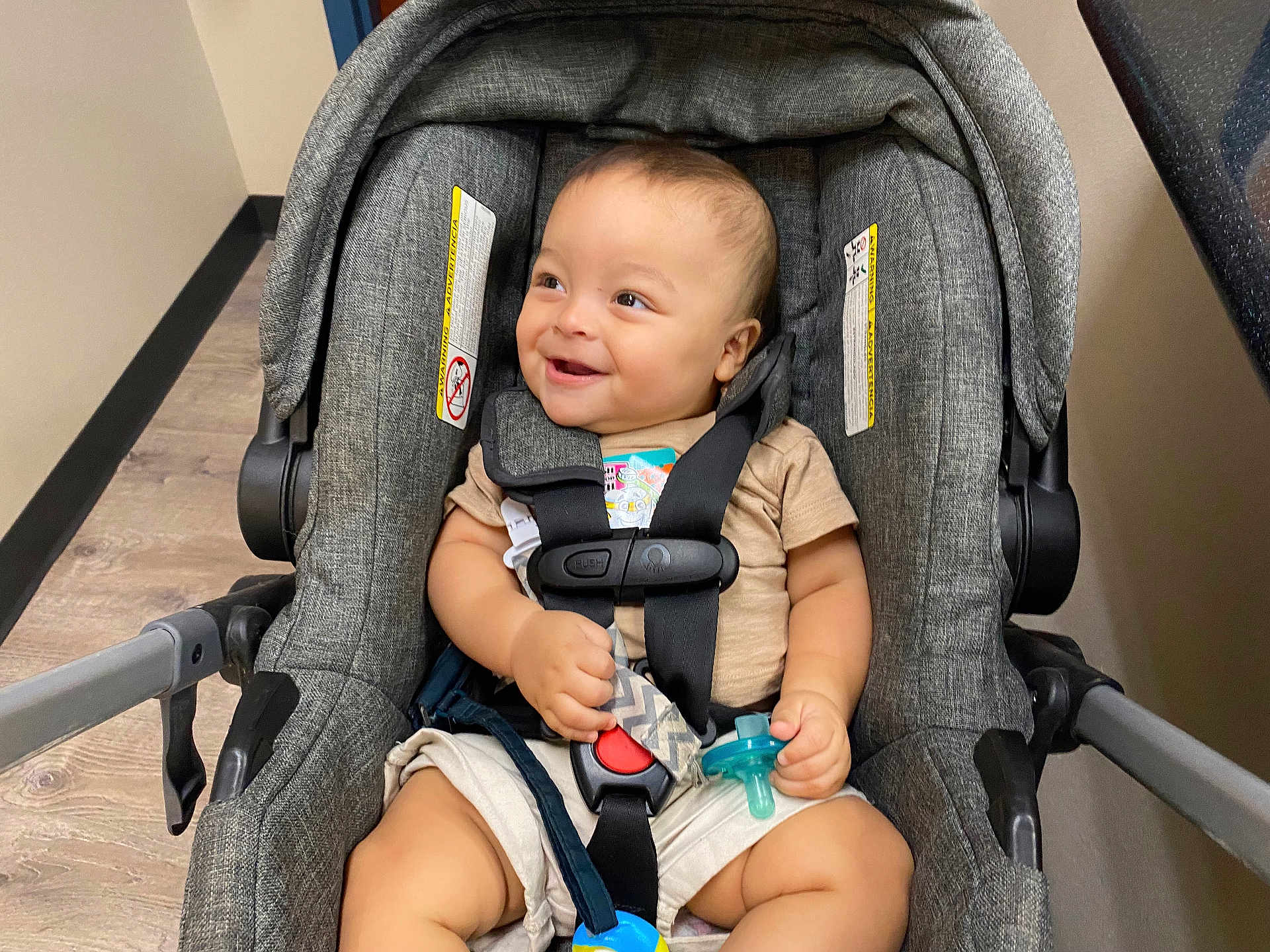 Joziah joined the competition — help win amazing prizes! baby, car_seat, infant, smiling, pacifier, toy, indoor, child, happiness, clothing, seatbelt, sitting, cute, young_child, person, floor, wall, safety_harness, expression, happy