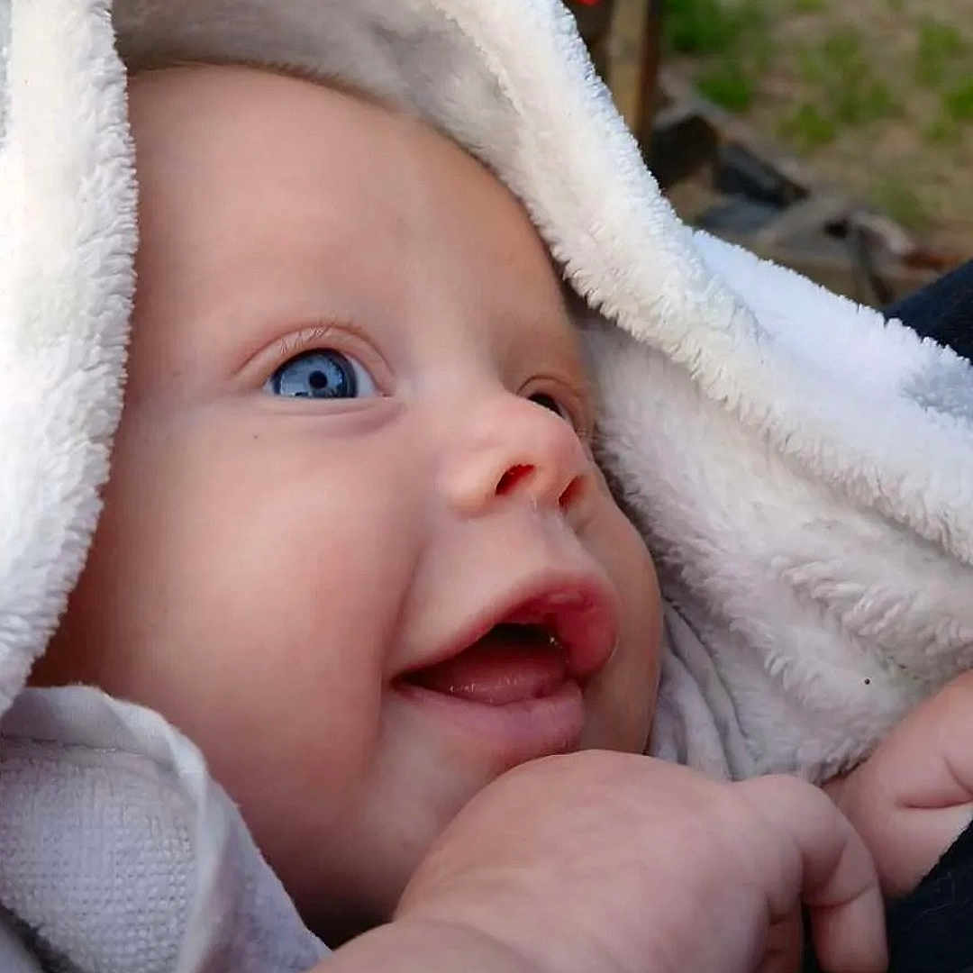 Ezeriah is registered to the contest to win money with this photo: baby, babylaughing, bonnet, clothing, face, happy, hat, head, hood, newborn, person, photography, portrait, smile