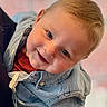 child, toddler, smile, face, denim_jacket, red_sweater, blond_hair, happy, portrait, closeup, cute, person, indoor, baby, young_child, clothing, casual, looking_at_camera, cheerful, human