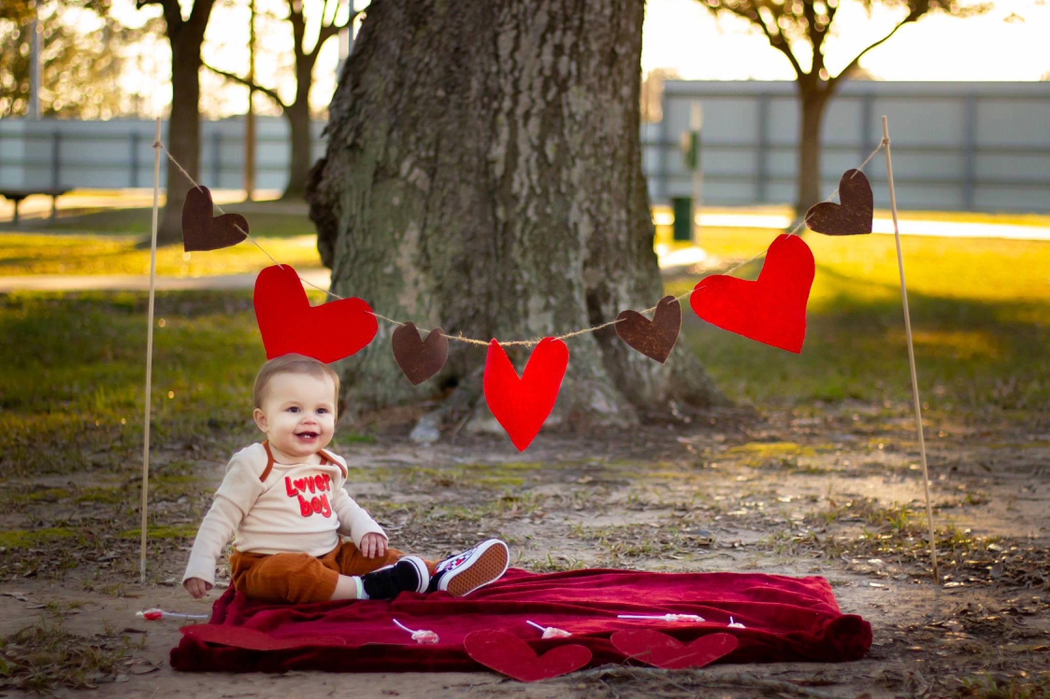 Kolsyn joined the competition — help win amazing prizes! baby, carmine, deciduous, fun, grass, happy, hat, joy, leaf, leisure, people, people_in_nature, person, plant, recreation, red, sitting, tints_and_shades, toddler, tree