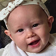 Ivy-Rose joined the competition — help win amazing prizes! baby, infant, face, headband, smile, white_clothing, bib, cute, child, skin, eyes, mouth, ear, portrait, indoors, head, expression, human, one_person, toddler