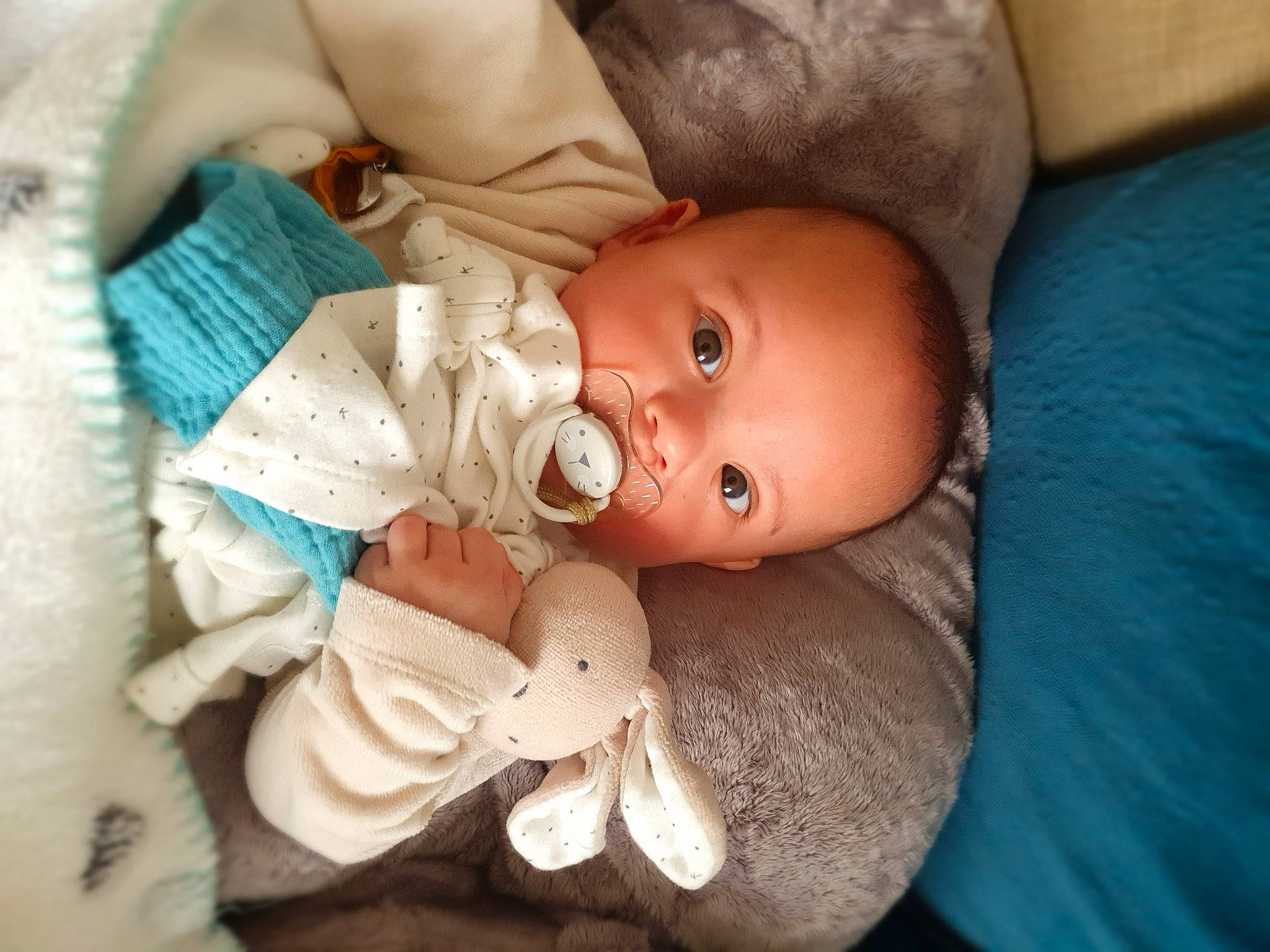 Henri-frédéric participe au concours pour gagner de l'argent avec cette photo : baby, baby_products, baby_toddler_clothing, cheek, child, close_up, comfort, ear, eyelash, headgear, iris, linens, lip, nail, nose, person, room, skin, toddler, toy