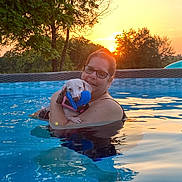 Lulu Campos joined the competition — help win amazing prizes! affection, dog, evening, glasses, harness, leisure, love, nature, outdoor, pet, pool, reflection, relaxation, summer, sunset, swimming, toy, trees, water, woman
