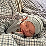 Kyren is registered to the contest to win money with this photo: newborn, baby, sleeping, blanket, hat, hand, bed, cozy, soft, checkered, clothing, infant, peaceful, portrait, closeup, rest, cute, warm, comfort, person