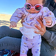 Cyana participe au concours pour gagner de l'argent avec cette photo : baby, child, sunglasses, pink, outdoor, person, clothing, legs, hands, adult, jeans, sitting, sky, sunlight, pattern, cute, fashion, casual, holding, portrait