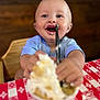 Sonny joined the competition — help win amazing prizes! baby, child, smiling, happy, face, whipped_cream, dessert, spoon, high_chair, table, red_and_white_checkered, food, messy_face, blue_shirt, indoor, cute, eating, close_up, person, fun