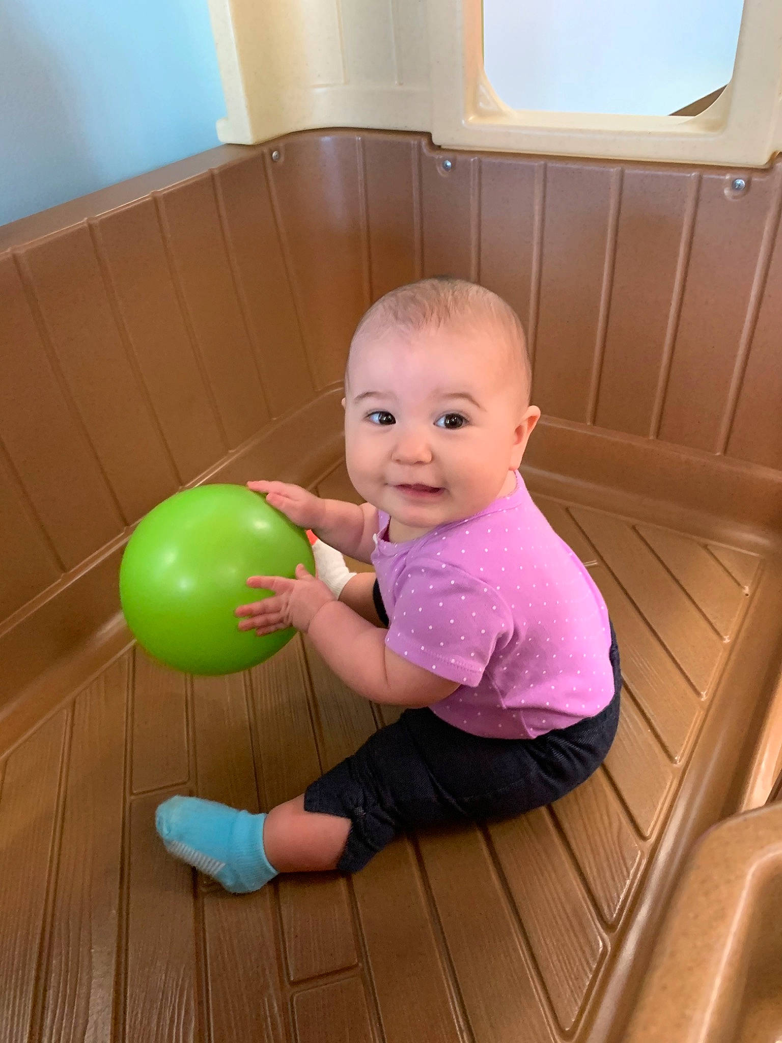 Raelynn is registered to the contest to win money with this photo: baby, ball, child, person, play, room, sitting, toddler