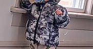 Storm Joe joined the competition — help win amazing prizes! baby, barefoot, bottle, carpet, casual, child, clothing, cute, drink, floor, home, hood, indoor, jacket, pajamas, person, standing, toddler, window, young