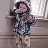baby, barefoot, bottle, carpet, casual, child, clothing, cute, drink, floor, home, hood, indoor, jacket, pajamas, person, standing, toddler, window, young