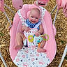 baby, infant, smiling, blue_eyes, pink_swing, toy, outdoor, rocky_ground, happy, child, seat, plush_toy, colorful, cute, summer, sunlight, playtime, baby_clothing, infant_toys, portrait