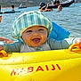 Alessio participe au concours pour gagner de l'argent avec cette photo : baby, boat, child, float, fun, happy, hat, inflatable, lake, outdoor, people, playful, summer, sun_hat, sunlight, swimming, tongue_out, vacation, water, water_sports