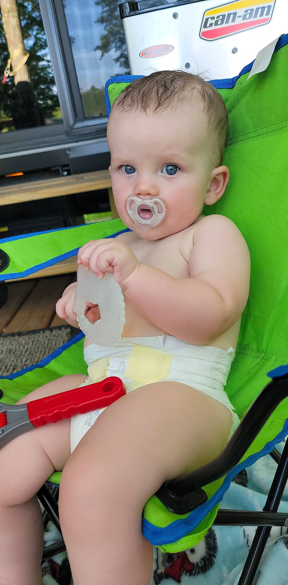 Rhyker is registered to the contest to win money with this photo: baby, baby_toddler_clothing, chair, cheek, eye, face, finger, green, hairstyle, hand, happy, human_body, iris, leg, organ, person, product, skin, thigh, white