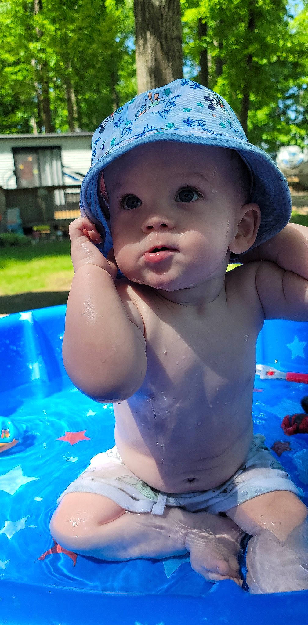 Rhyker is registered to the contest to win money with this photo: azure, baby, blue, face, fun, grass, green, happy, hat, head, headwear, human_body, leisure, light, muscle, person, photograph, product, skin, toddler