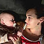 Luella is registered to the contest to win money with this photo: baby, woman, pacifier, holding, face, portrait, intimate, indoor, love, mother, child, skin, tattoo, clothing, red, smile, earring, hand, expression, closeup