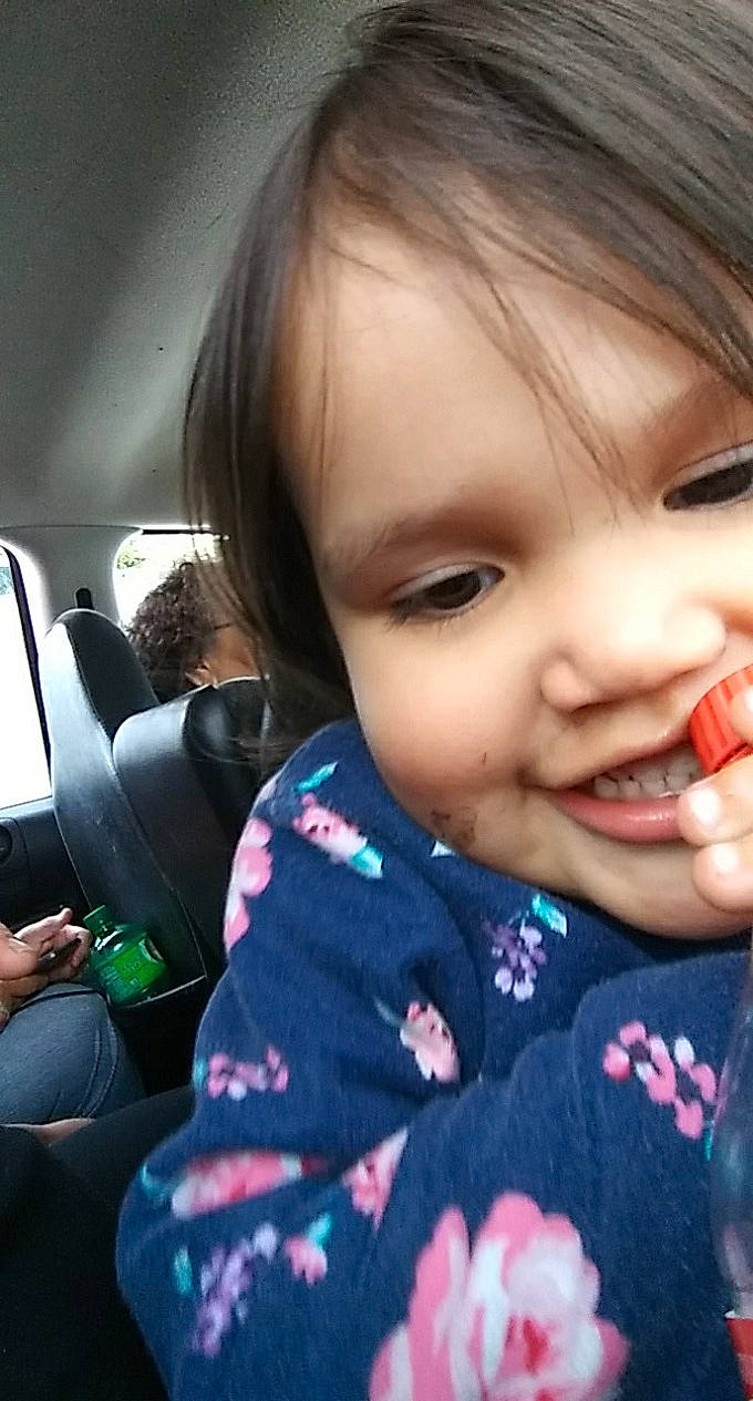 Sherry is registered to the contest to win money with this photo: baby, beauty, black_hair, cheek, child, cool, ear, electronic_device, eye, face, finger, head, lip, mouth, nose, person, skin, smile, technology, toddler