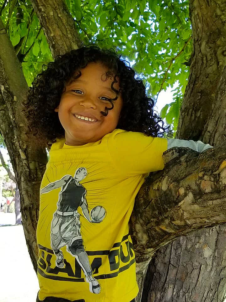 Isaiah joined the competition — help win amazing prizes! black_hair, joy, person, photography, plant, smile, t_shirt, tree, trunk, woody_plant, yellow