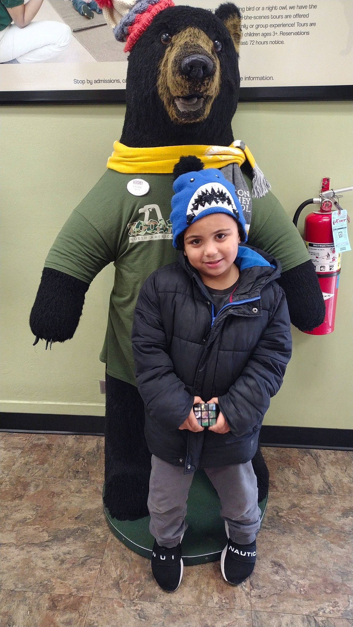 Jayvion is registered to the contest to win money with this photo: boot, cap, cool, costume, electric_blue, event, fire_extinguisher, fun, fur, glove, headwear, helmet, jacket, joy, mascot, outerwear, person, personal_protective_equipment, recreation, smile