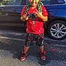 Jayvion joined the competition — help win amazing prizes! child, boy, smiling, portrait, outdoor, driveway, car, blue_car, backpack, red_shirt, shorts, sneakers, fashion, standing, posing, sunlight, residential, street, vehicle, happy