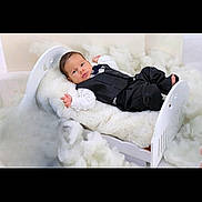 Adem participe au concours pour gagner de l'argent avec cette photo : baby, infant, child, suit, formal_wear, bed, blanket, cotton, fluffy, white, portrait, cute, small, lying_down, studio, soft_texture, sleepy, adorable, indoors, resting
