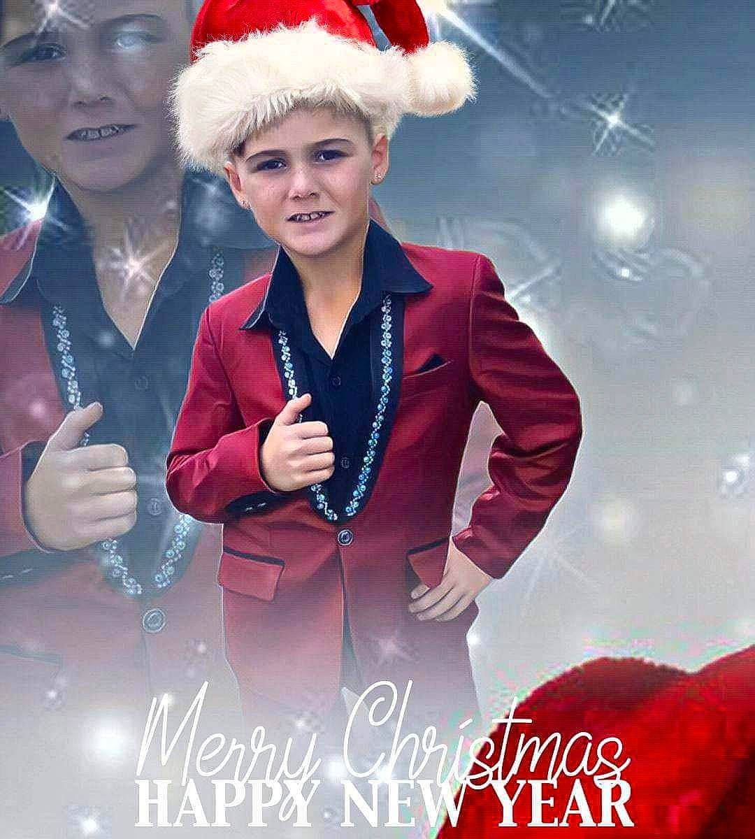 Declan is registered to the contest to win money with this photo: arm, beauty, cool, event, facial_expression, fashion, fashion_design, fictional_character, formal_wear, fun, gesture, glove, happy, hat, headwear, human, magenta, people, person, red