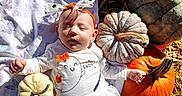 Aaryah is registered to the contest to win money with this photo: baby, infant, child, sleepy, autumn, pumpkin, pumpkin_patch, gourds, hay, straw, headband, bow, onesie, blanket, outdoor, portrait, lying_down, harvest, fall, rustic