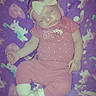 baby, infant, sleeping, bow, pink_clothing, purple_blanket, polka_dots, sitting, portrait, face, closed_eyes, peaceful, cozy, nursery, textile, soft_lighting, indoor, child, adorable, vintage_filter