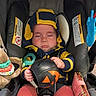 Braxtyn joined the competition — help win amazing prizes! baby, infant, sleeping, car_seat, harness, winter_clothing, hat, jacket, ball, pumpkin, stuffed_animal, teether, toy, pink_purse, vehicle, indoor, portrait, child, sitting, safe