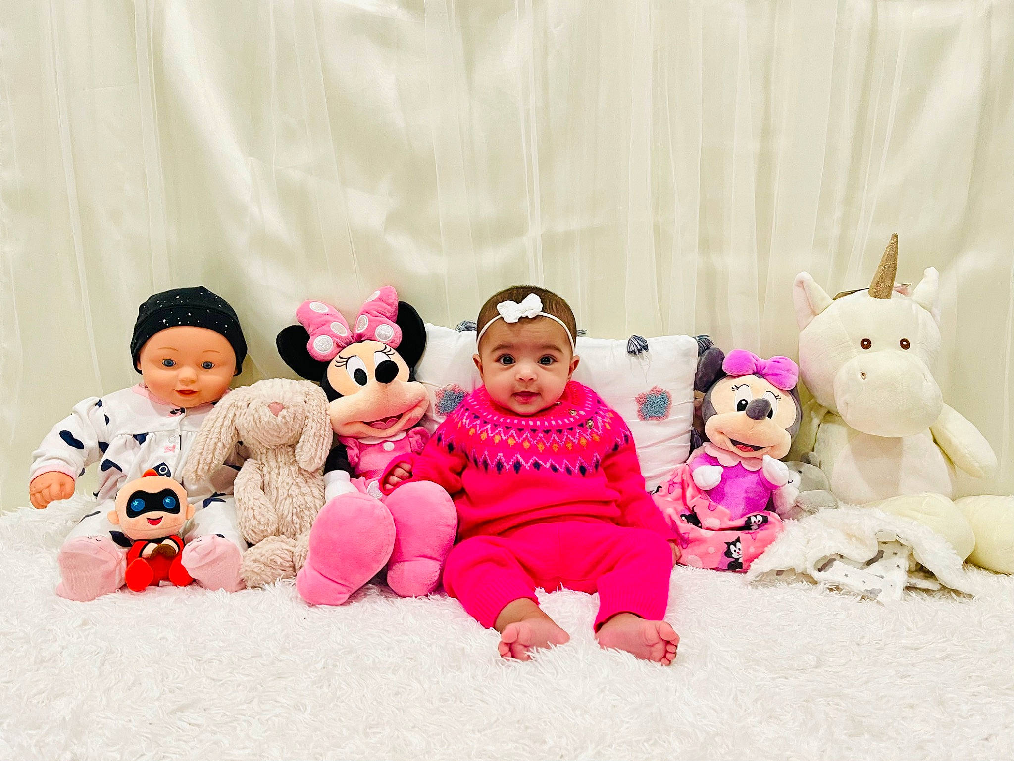 Sitara is registered to the contest to win money with this photo: baby_toddler_clothing, baby_toys, child, design, doll, fawn, font, happy, headwear, leisure, magenta, mammal, person, pink, plush, product, sleeve, stuffed_toy, teddy_bear, textile
