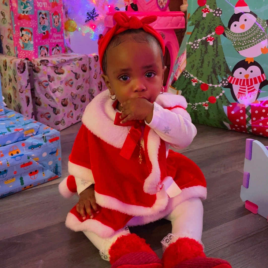 Nalani joined the competition — help win amazing prizes! accessories, baby, bodypart, clothing, costume, couch, face, finger, footwear, furniture, hand, hardwood, hat, head, person, photography, portrait, shoe, sitting, wood