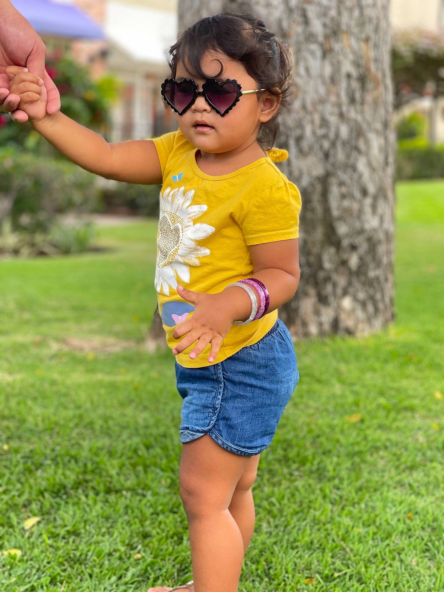 Aiko joined the competition — help win amazing prizes! cool, eyewear, facial_expression, finger, glasses, goggles, grass, green, hand, happy, leg, leisure, people_in_nature, person, photograph, plant, shorts, shoulder, sunglasses, vision_care