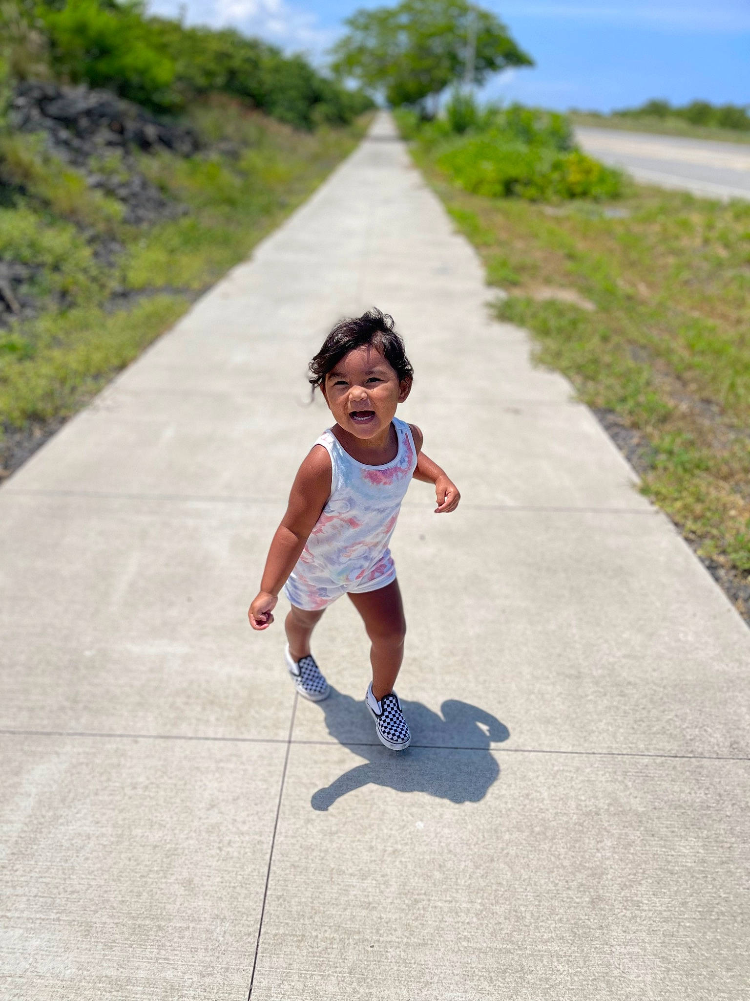 Aiko joined the competition — help win amazing prizes! asphalt, baby, body_of_water, cloud, grass, happy, human_leg, landscape, leisure, people_in_nature, person, plant, recreation, road, road_surface, shorts, sidewalk, sky, summer, toddler