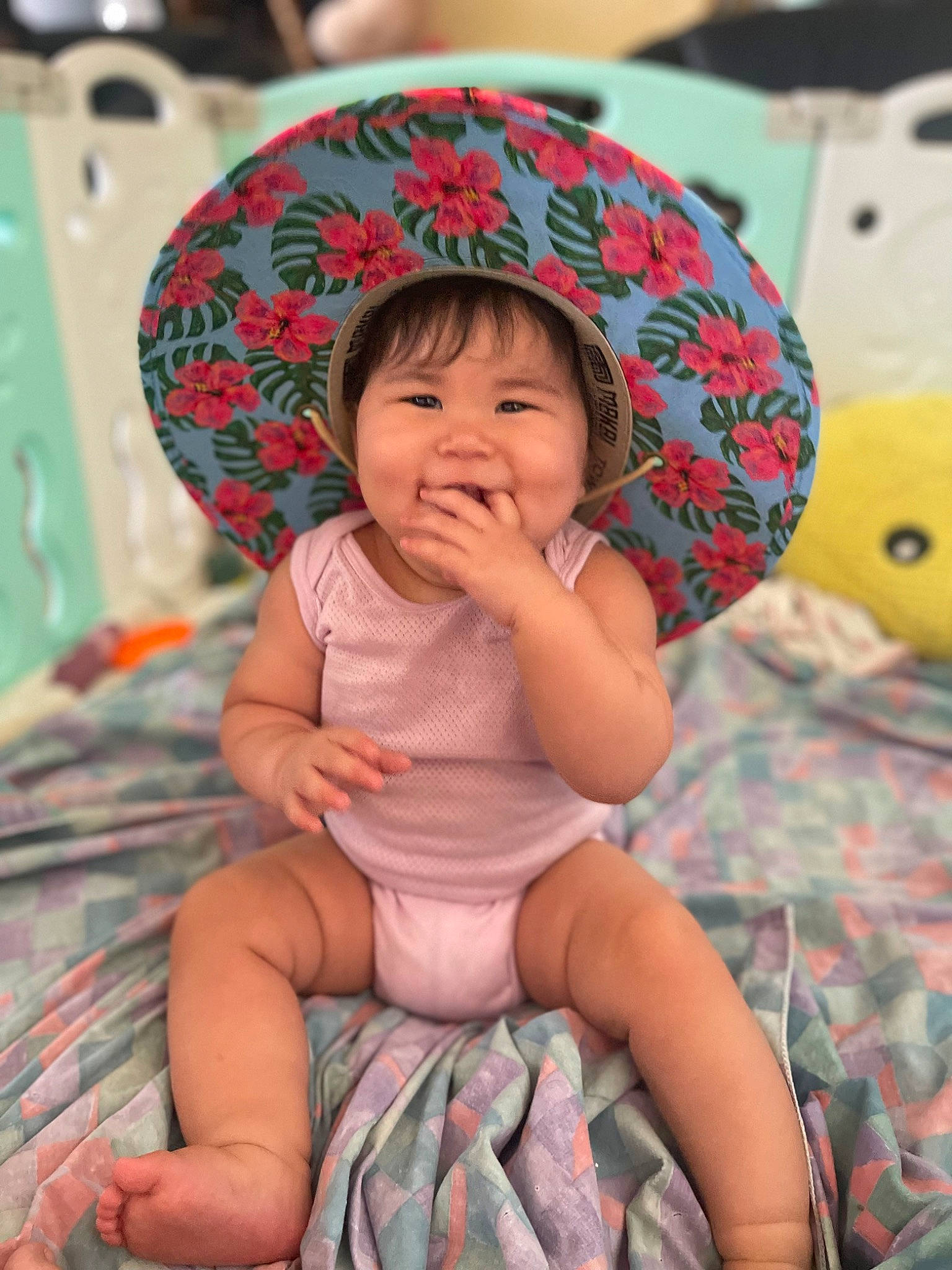 Kairie is registered to the contest to win money with this photo: baby, baby_toddler_clothing, black_hair, cheek, child, comfort, fun, green, happy, joy, leisure, lip, mouth, person, pink, product, skin, smile, sun_hat, textile