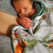 Jace is registered to the contest to win money with this photo: baby, blanket, close_up, cozy, cute, floral_blanket, fox_pattern, hospital_setting, medical_tube, nasal_cannula, newborn, pacifier, parent_arm, peaceful, portrait, skin_to_skin, sleeping_baby, soft_texture, swaddled, tiny_hand