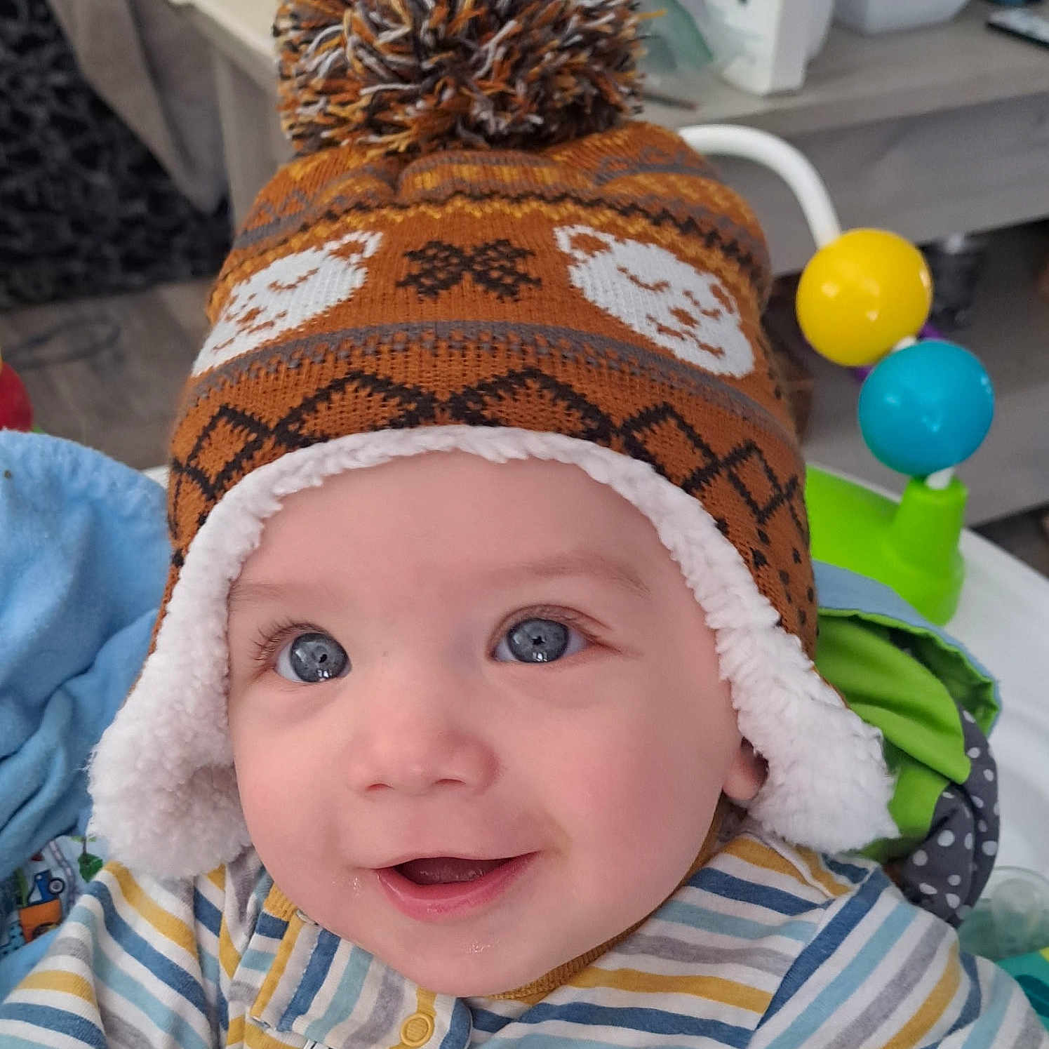 Malcom is registered to the contest to win money with this photo: adult, baby, balloon, beanie, bonnet, cap, clothing, coat, face, female, glove, happy, hat, head, hood, person, photography, portrait, smile, woman