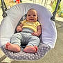 baby, smiling, swing, outdoor, sunlight, infant, clothing, feet, face, happy, person, seat, cushion, concrete, background, garden, blurred, casual, relaxed, cute